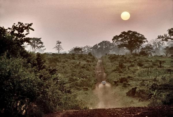 Photograph Klaus Oskar Bromberg Walking Man And Car On A Dusty Road In Ghana on One Eyeland